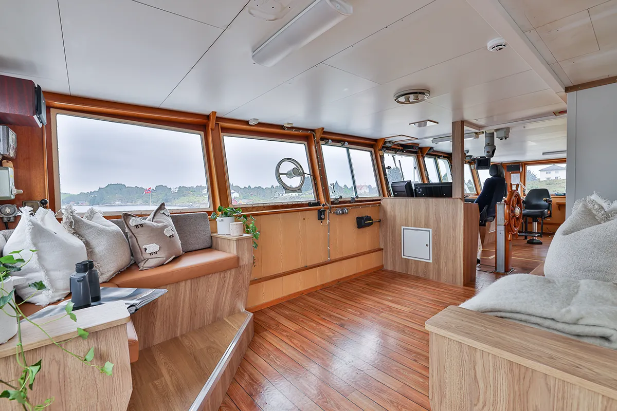 Interior view of the bridge and navigation area aboard Vikingfjord expedition vessel with panoramic sea view