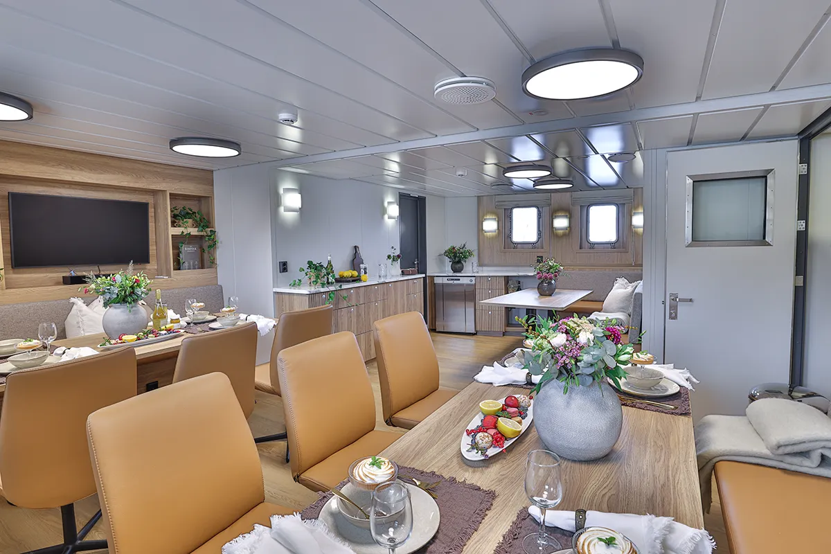 Restaurant and dining area aboard Vikingfjord expedition vessel with sea view and elegantly set tables