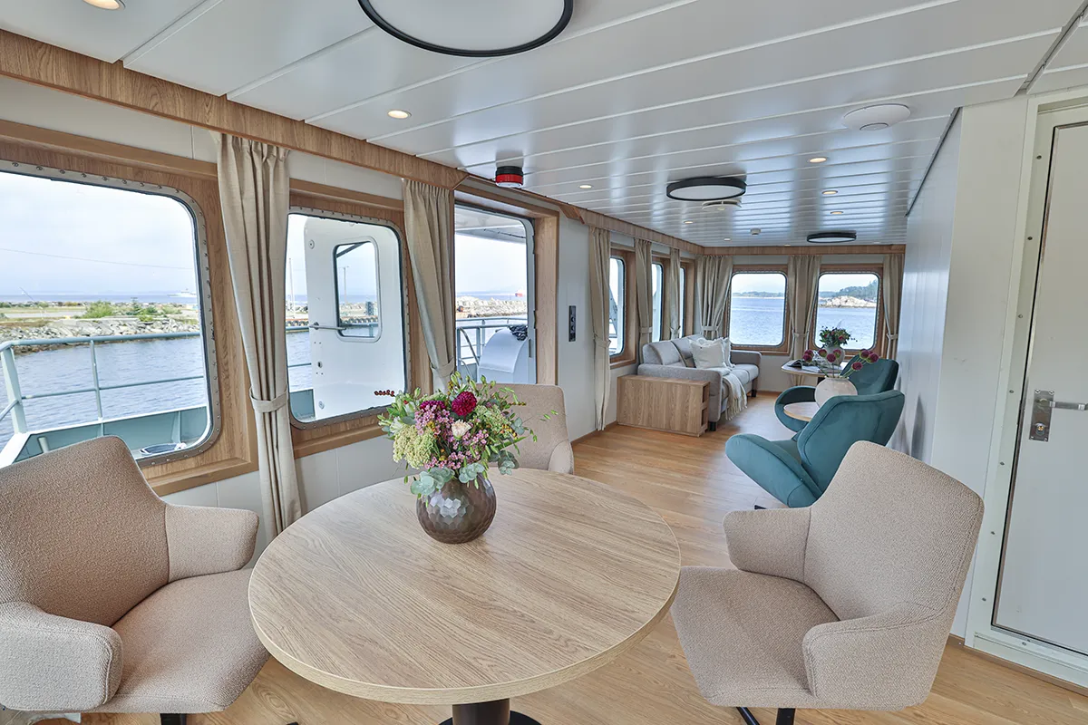 Observation lounge interior aboard Vikingfjord expedition vessel with sea views through large windows