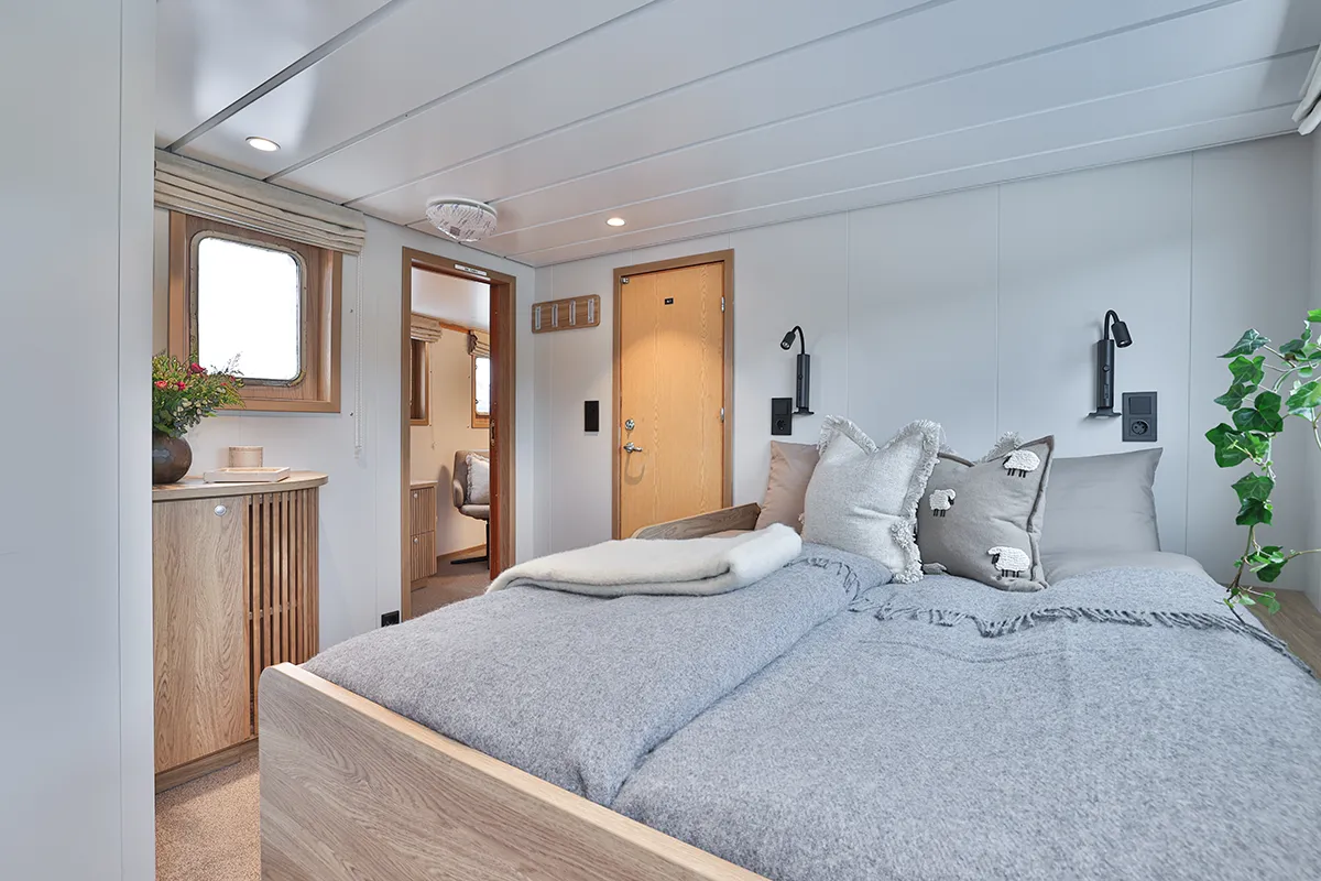 Spacious penthouse cabin interior aboard Vikingfjord expedition vessel with sea view windows