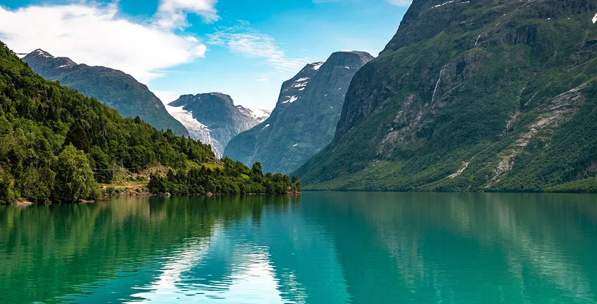 Scenic fjord landscape in western Norway with green mountains and turquoise water near Loen and Stryn